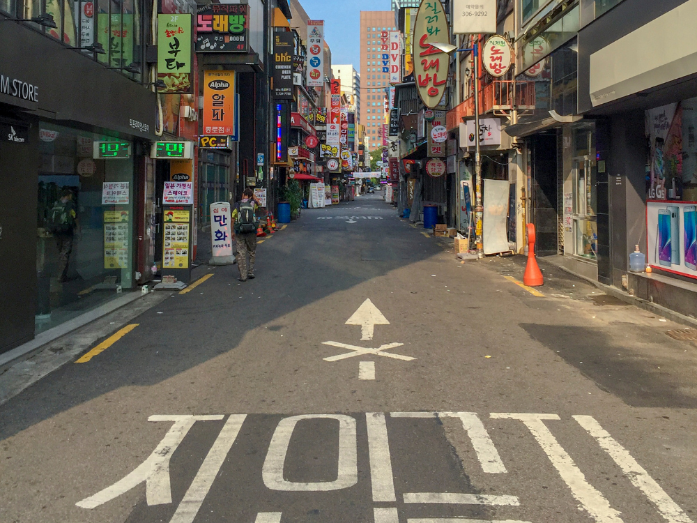 Myeongdong district in Seoul at night with neon signs